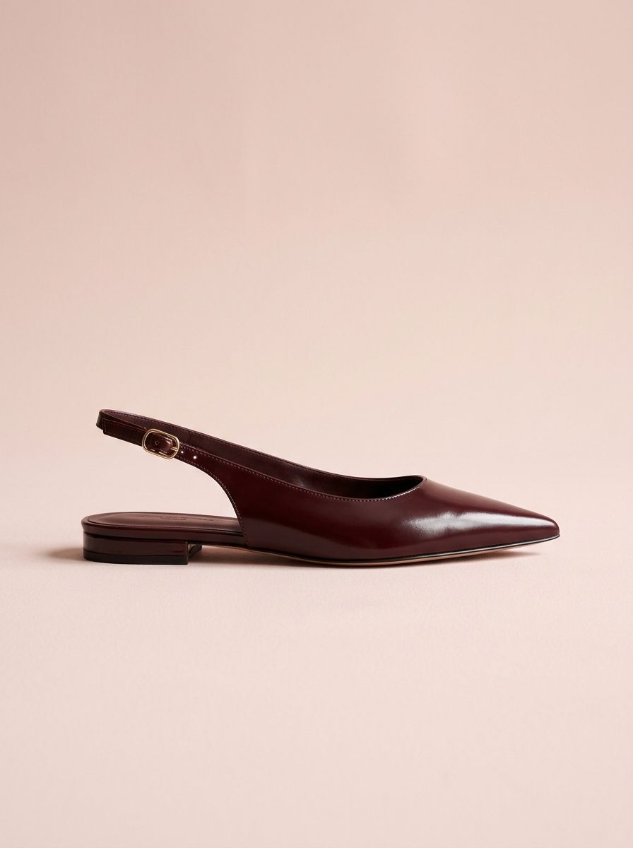 Burgundy leather slingback flat on a blush pink background